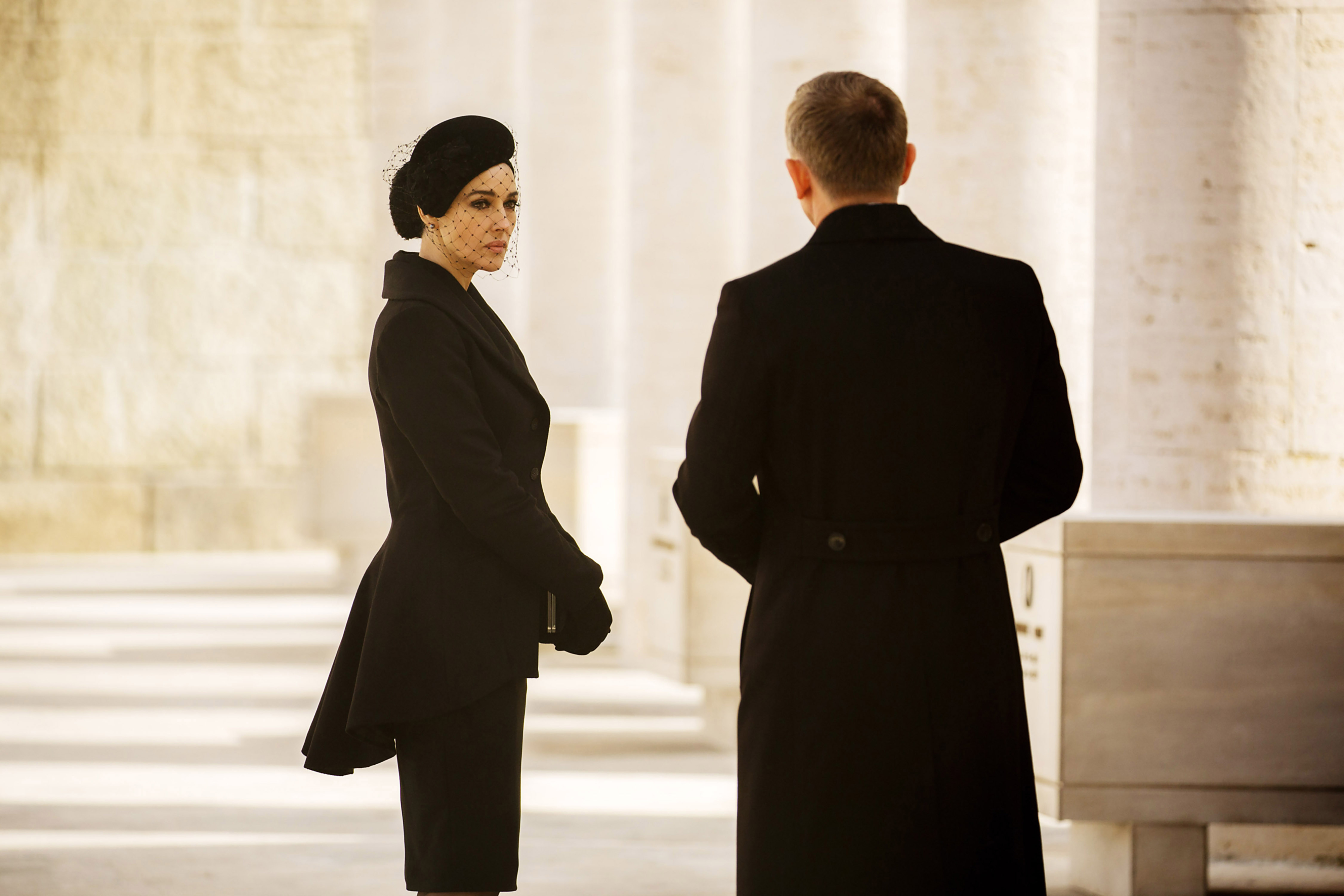 Monica Bellucci and Daniel Craig in dark, formal clothing in "Spectre"