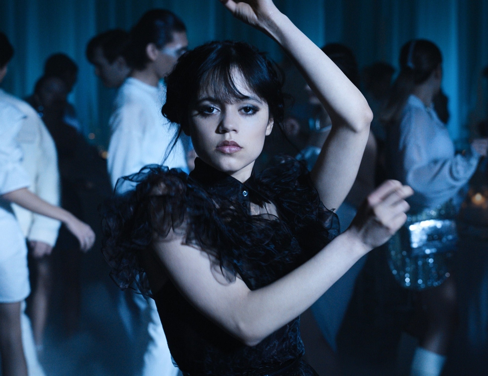 Jenna Ortega in a black dress, dancing in a scene from "Wednesday"