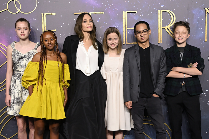 Shiloh Jolie-Pitt, Zahara Jolie-Pitt, Angelina Jolie, Vivienne Jolie-Pitt, Maddox Jolie-Pitt, and Knox Jolie-Pitt pose in stylish outfits at an &lsquo;Eternals&rsquo; event