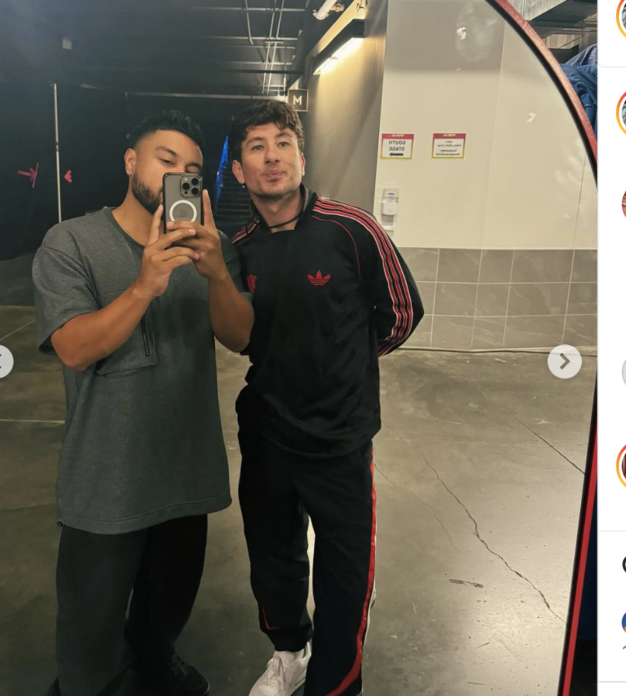 Alfredo Flores and Barry Keoghan posing together; Alfredo is taking a mirror selfie, Barry is wearing a casual tracksuit with Adidas logos