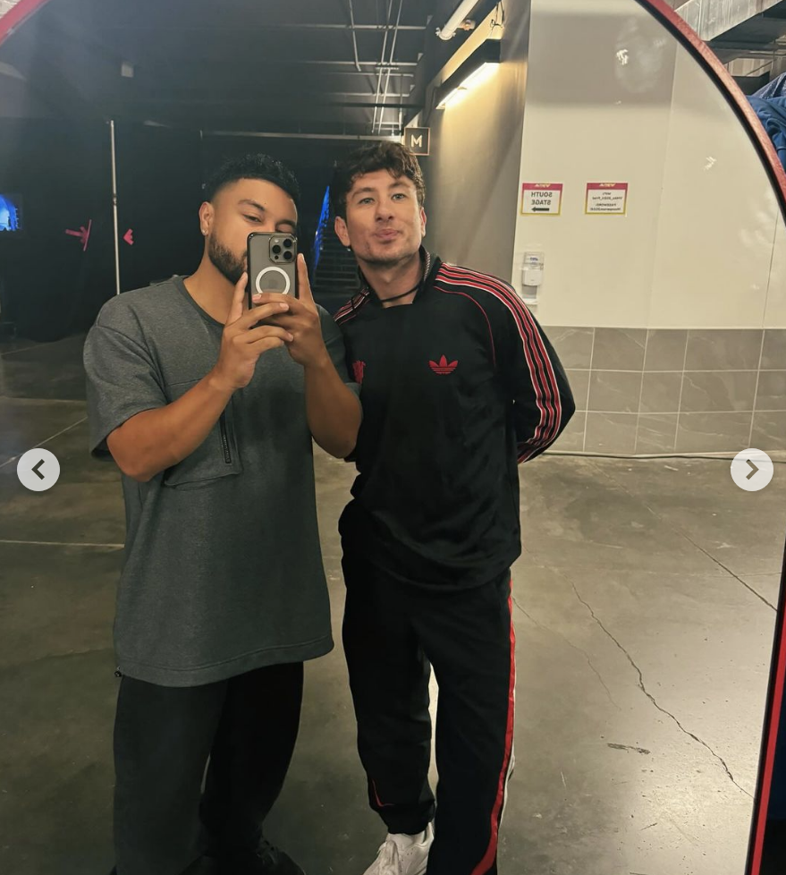 Alfredo Flores and Barry Keoghan posing together; Alfredo is taking a mirror selfie, Barry is wearing a casual tracksuit with Adidas logos
