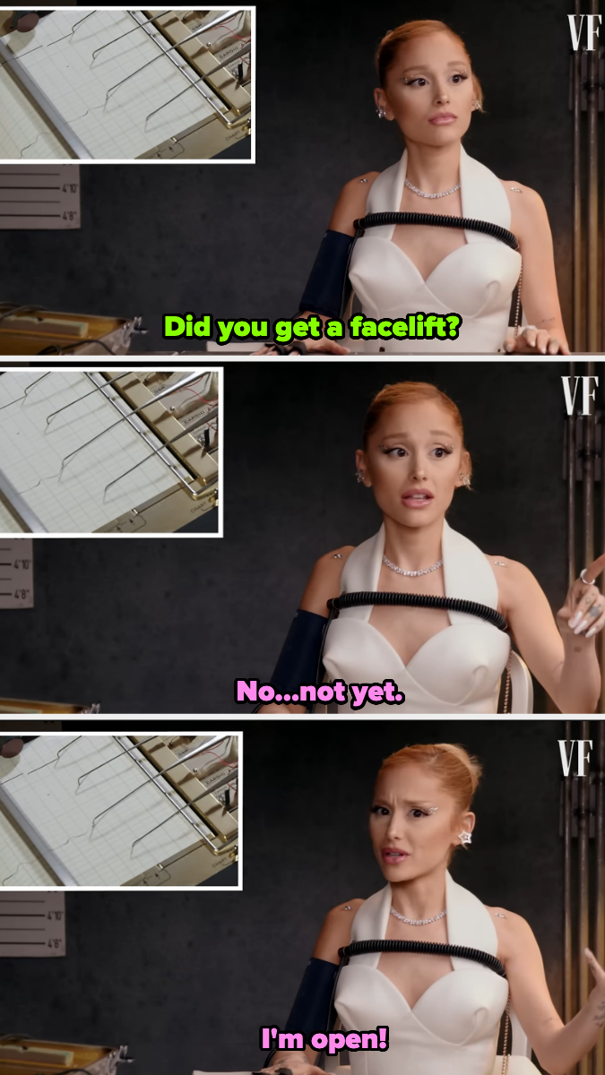 Ariana Grande sits at a Vanity Fair interview, wearing an elegant white dress with black accents, and answers questions humorously about getting a facelift
