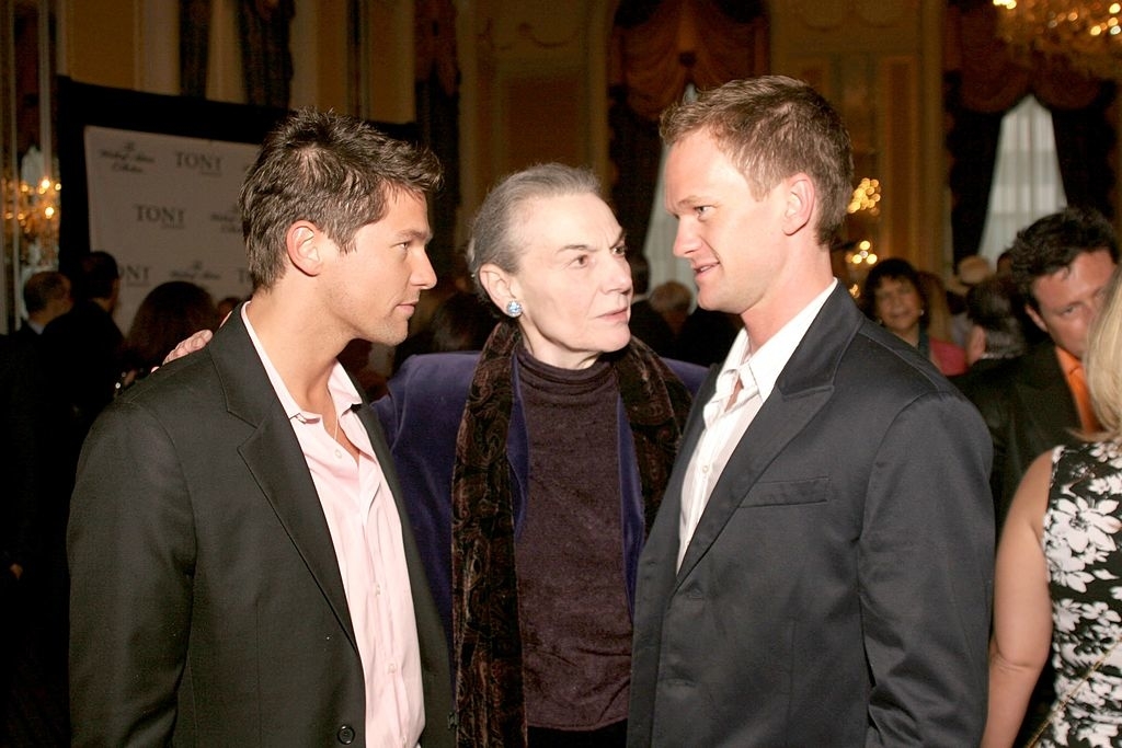 Sean Hayes, Marian Seldes, and Neil Patrick Harris at an event, wearing formal attire and engaged in conversation
