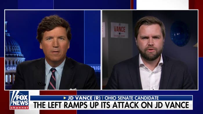 Tucker Carlson interviews JD Vance on Fox News channel. The text at the bottom reads: "The left ramps up its attack on JD Vance"