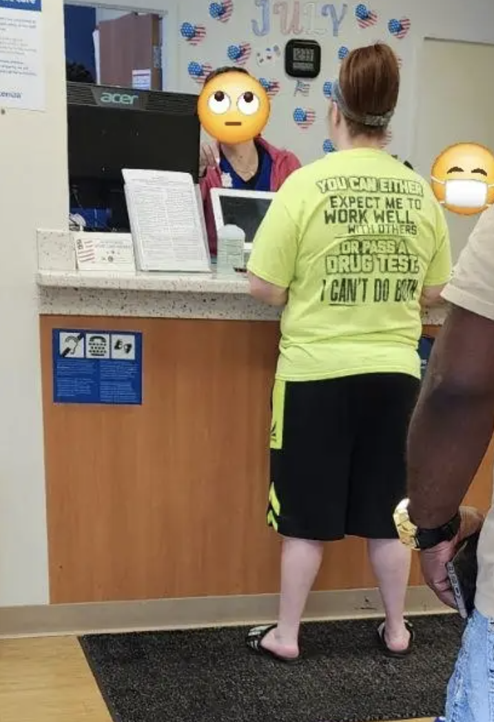 Customer at a service counter wearing a humorous shirt that says, &quot;You can either expect me to work well with others or pass a drug test. I can&#x27;t do both.&quot;