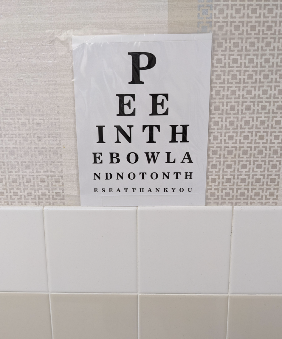 Eye chart with text forming a hidden message: "PEE IN THE BOWL AND NOT ON THE SEAT THANK YOU."