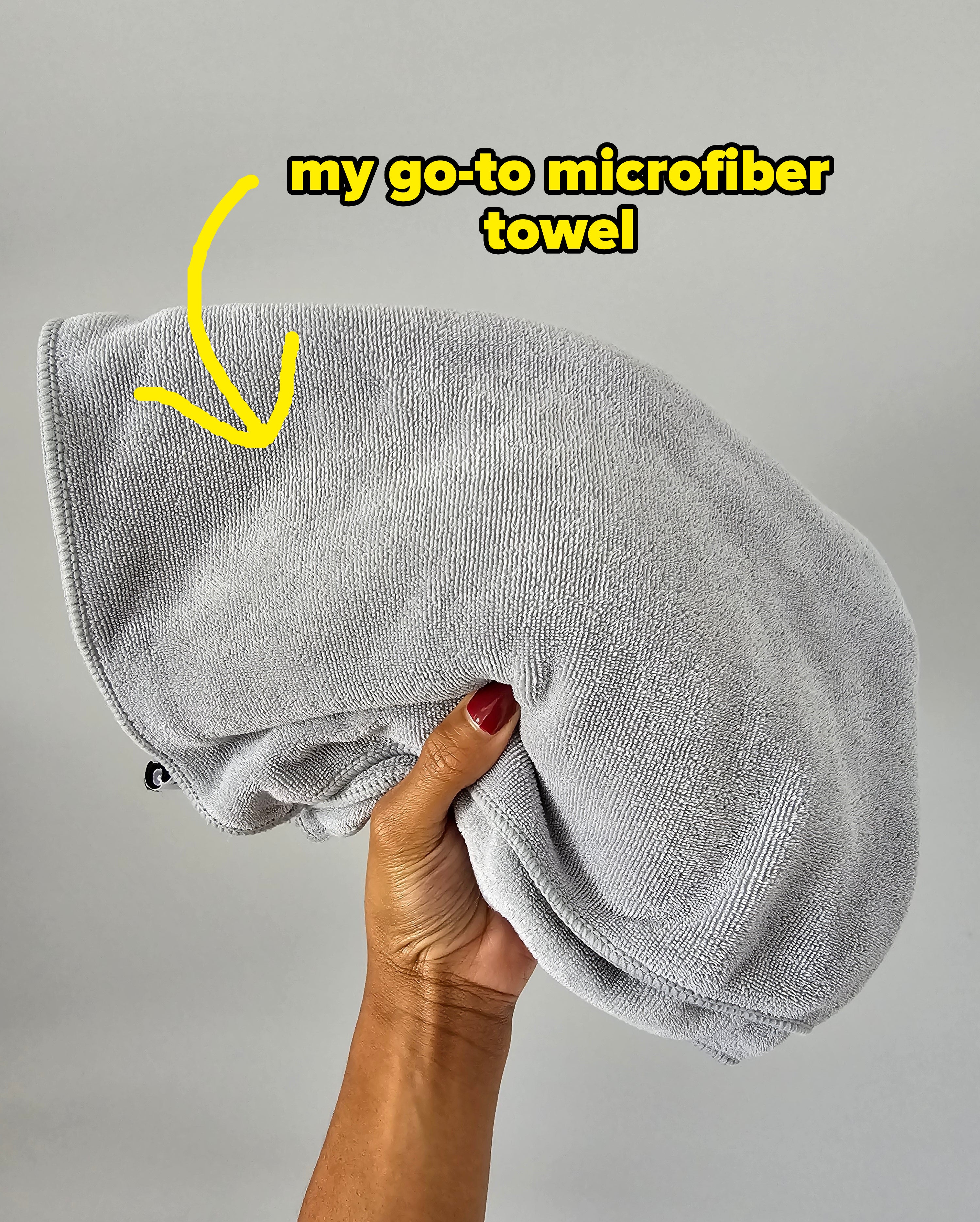 A folded gray microfiber towel