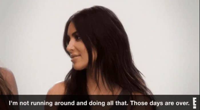 Kim Kardashian talking to her sister Khloe on the set of their show