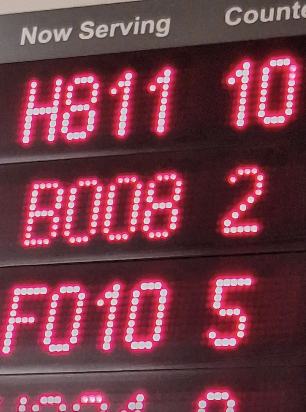 Display board showing numbers being served: HB11, 10; B008, 2; F010, 5