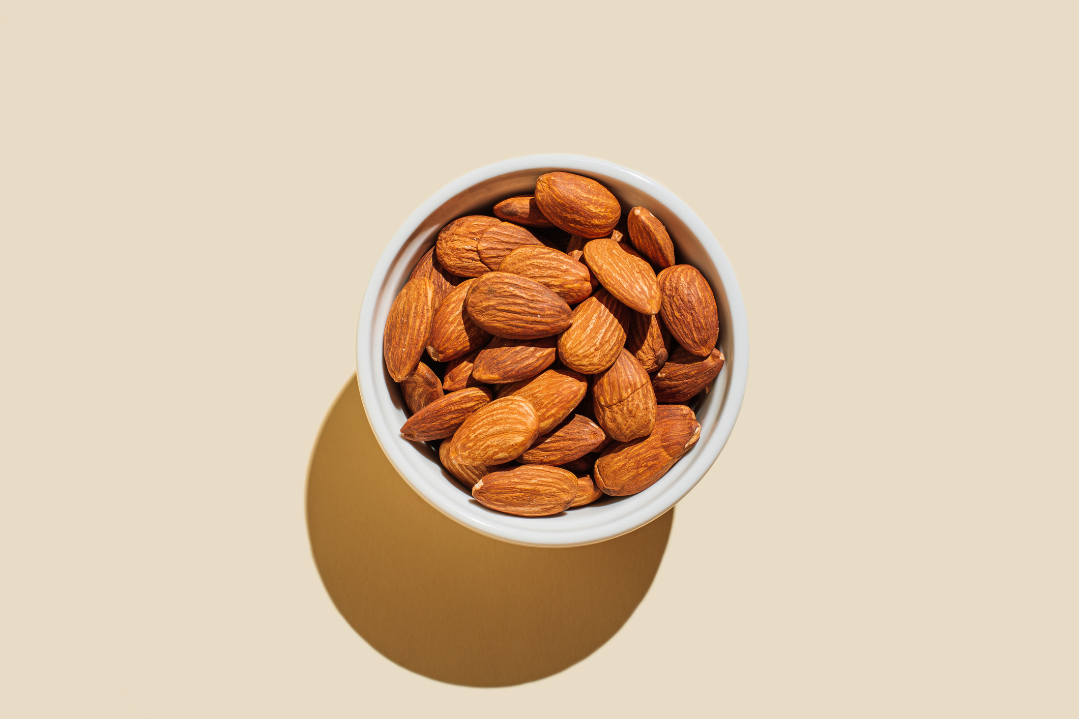 A bowl full of almonds viewed from above