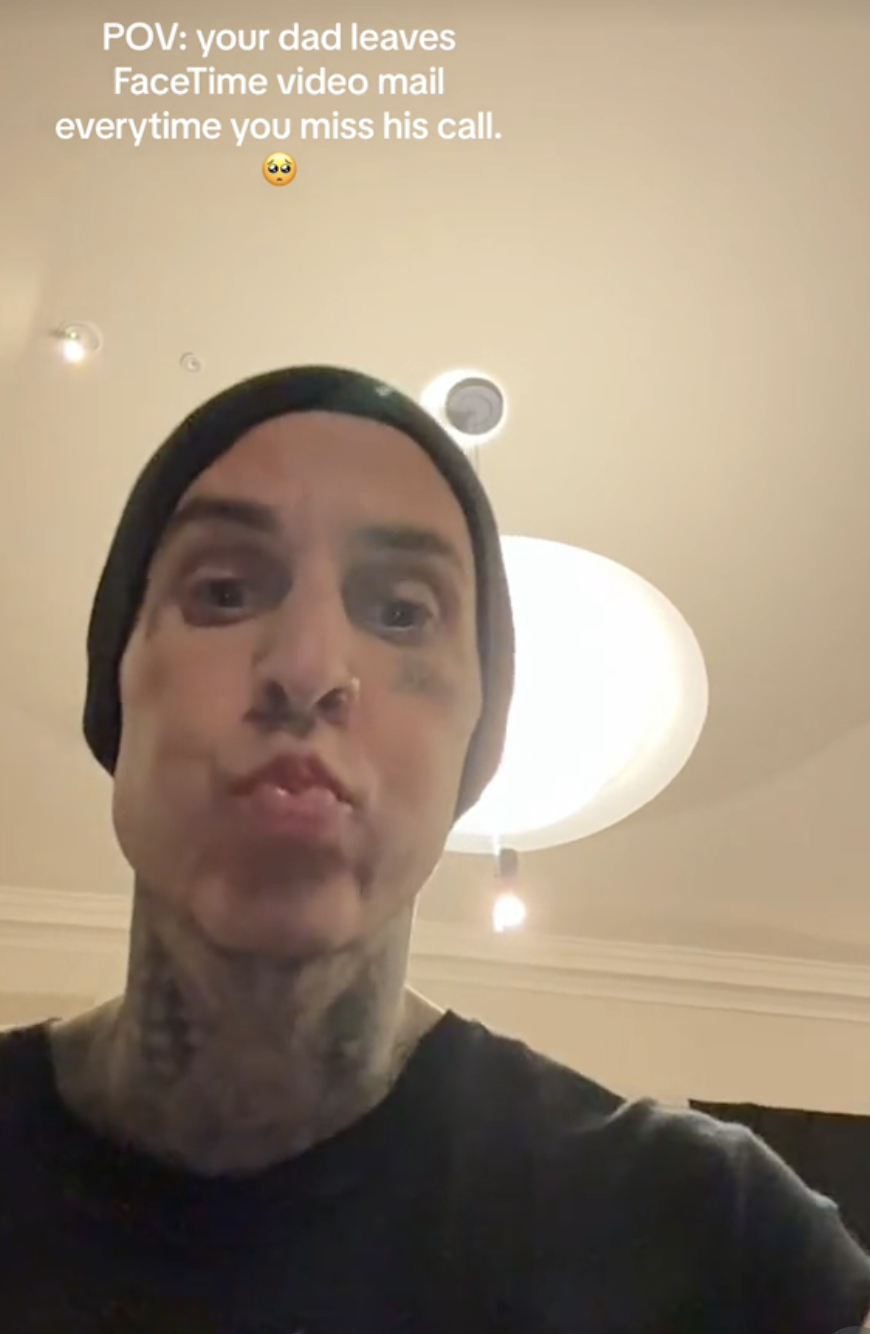 Travis Barker makes a pouty face in a selfie with the text overlay &quot;POV: your dad leaves FaceTime video mail everytime you miss his call.&quot;