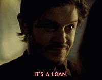 I don't know who these individuals are. A man with a slight smile says, "It's a loan." The image is from "American Gods" by STARZ