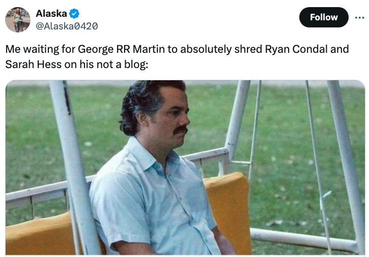 Man sitting on a swing set looking distant. Meme caption above reads, &quot;Me waiting for George RR Martin to absolutely shred Ryan Condal and Sarah Hess on his not a blog.&quot;