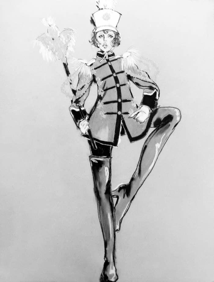 A person striking a pose in a classic marching band drum major uniform with tall boots and a feathered hat