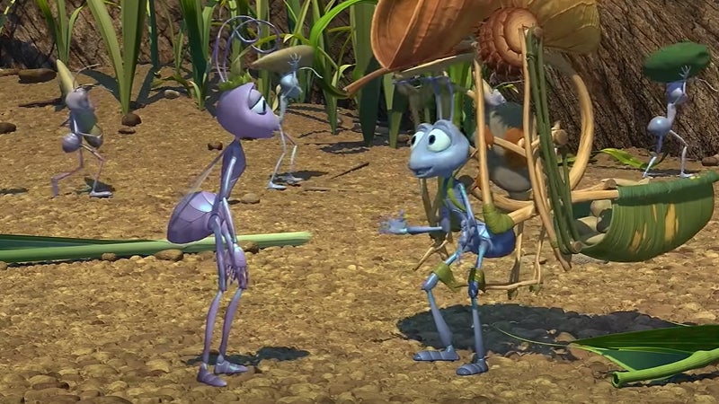 Atta and Flik talking while he is carrying an invention on his back.
