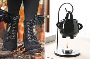 Black lace-up boots with bat wing accents are pictured next to a black, cauldron-shaped wax warmer over a lit tealight candle