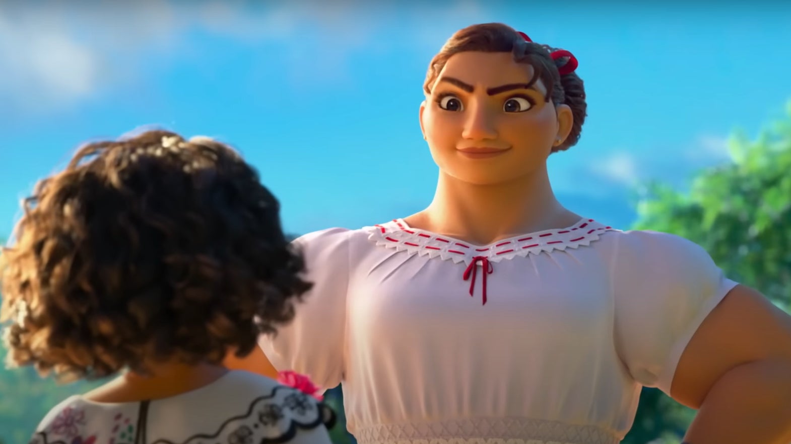 Luisa looking down on Mirabel with her hands on her hips.