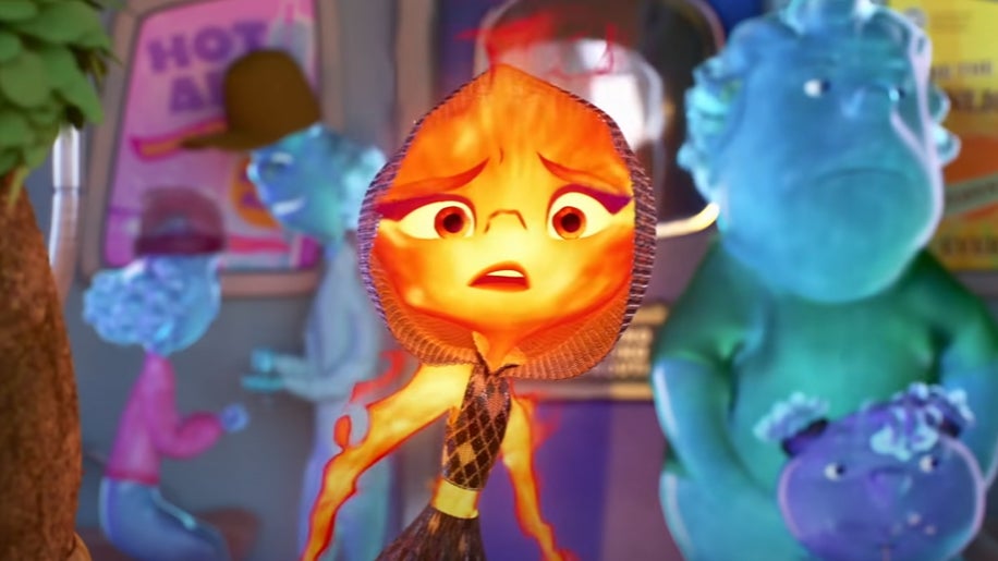 Ember wearing a hood on a train around water elements.