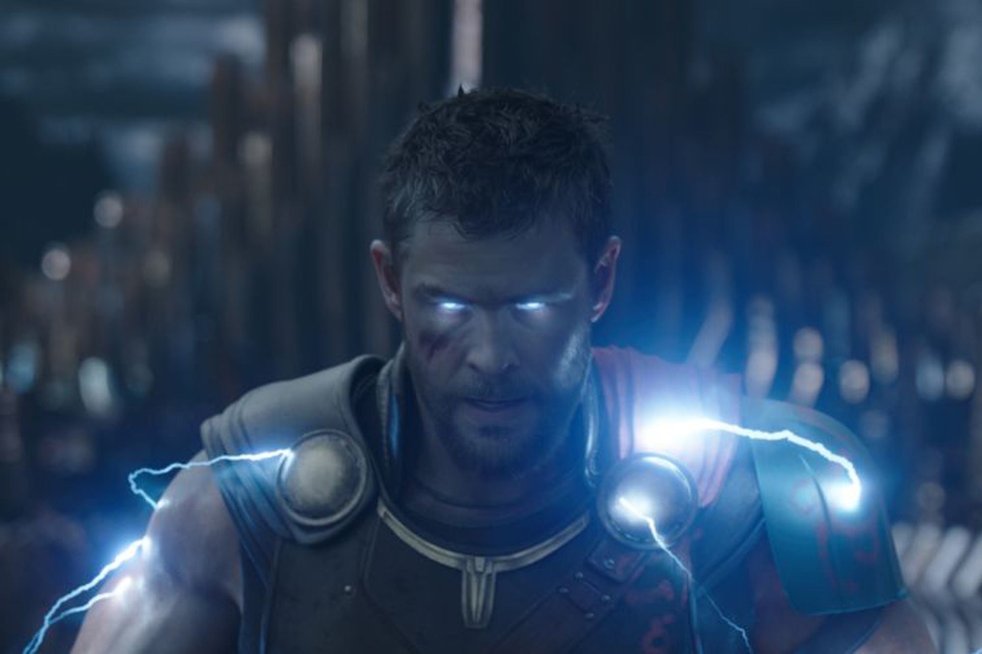 Chris Hemsworth as Thor with lightning eyes and armor, looking determined