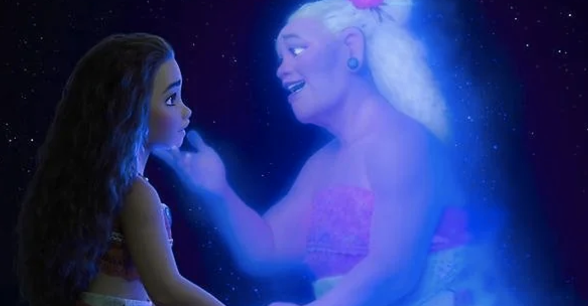 Moana, a young girl with long hair, looks up at a smiling Tala, an elderly woman with a flower in her hair, who appears as a glowing spirit