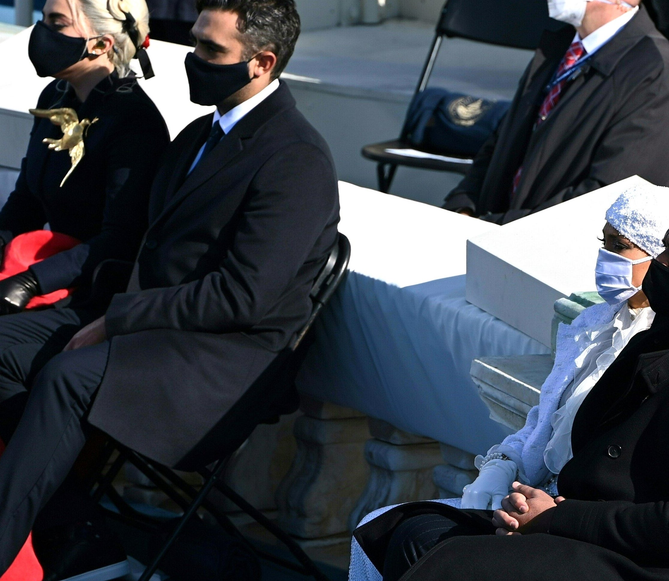 Lady Gaga and Michael Polansky at an outdoor event, all wearing face masks