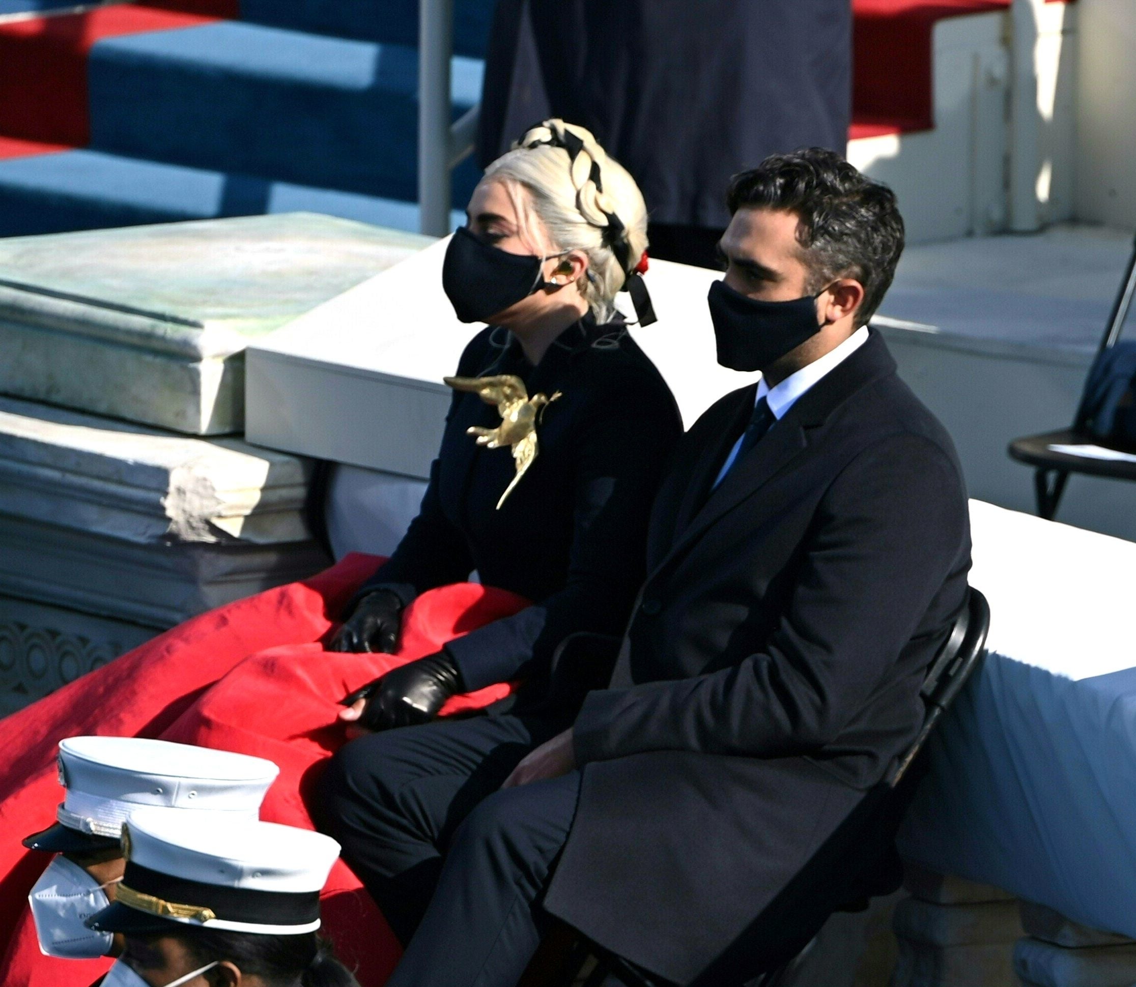 Lady Gaga and Michael Polansky at an outdoor event, all wearing face masks