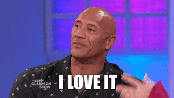 Dwayne "The Rock" Johnson on The Kelly Clarkson Show, smiling and nodding with the caption "I LOVE IT" displayed at the bottom