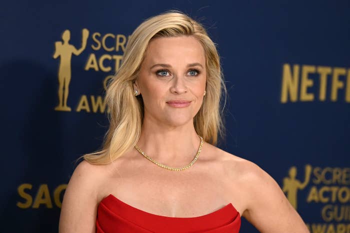 Reese Witherspoon poses on the red carpet at the Screen Actors Guild Awards in a strapless gown and minimal jewelry