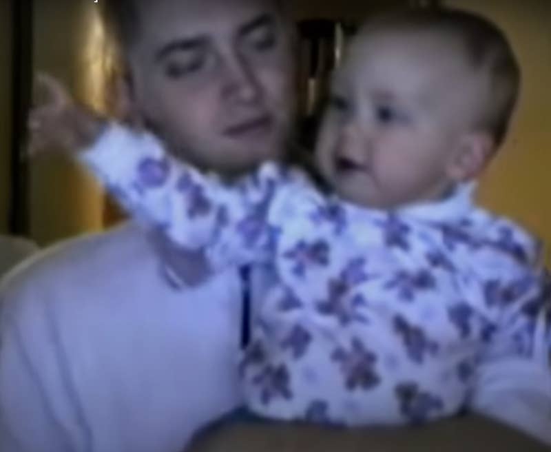 Eminem holding Hailie Jade as a baby