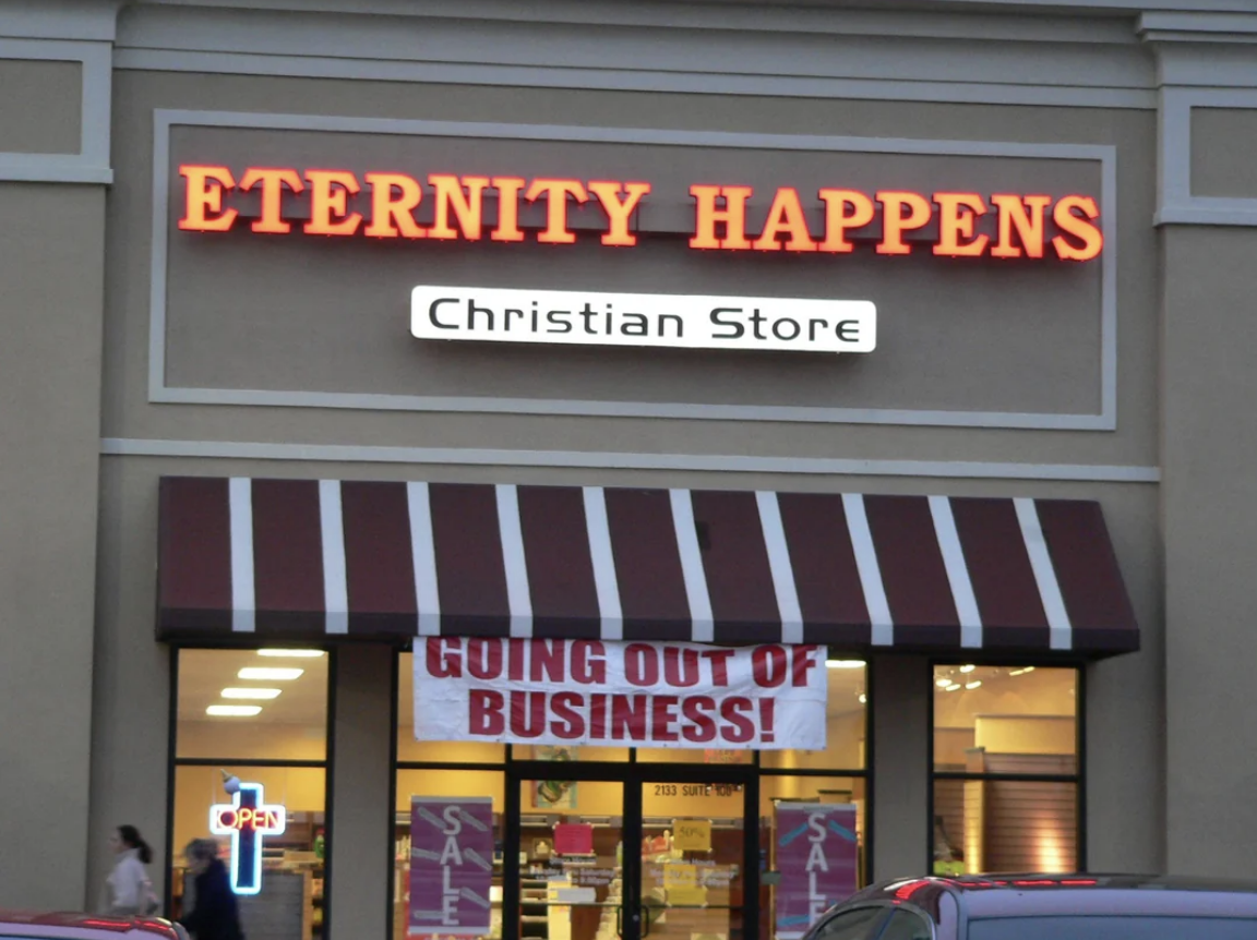 Front of Eternity Happens Christian Store with a "Going Out of Business!" banner above the entrance