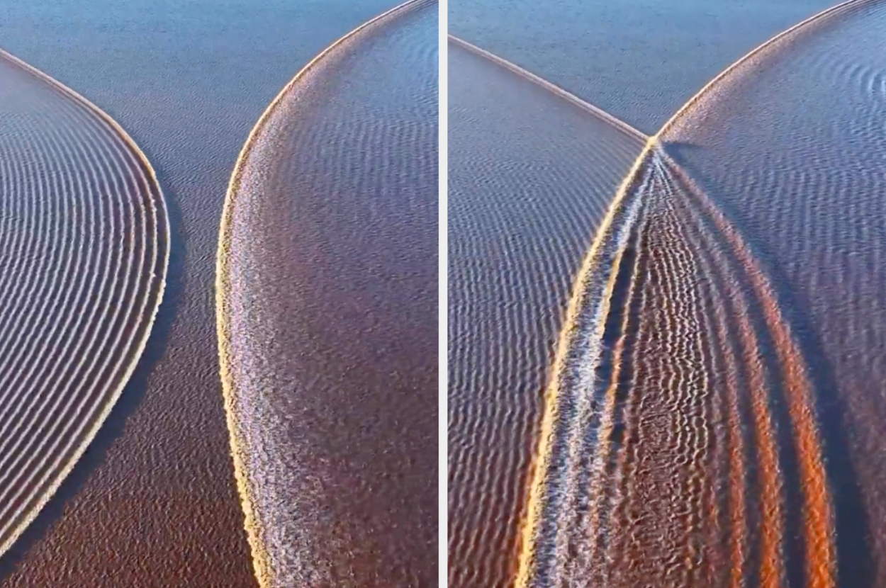 A boat leaves symmetrical wave patterns in still water, creating a visually striking design