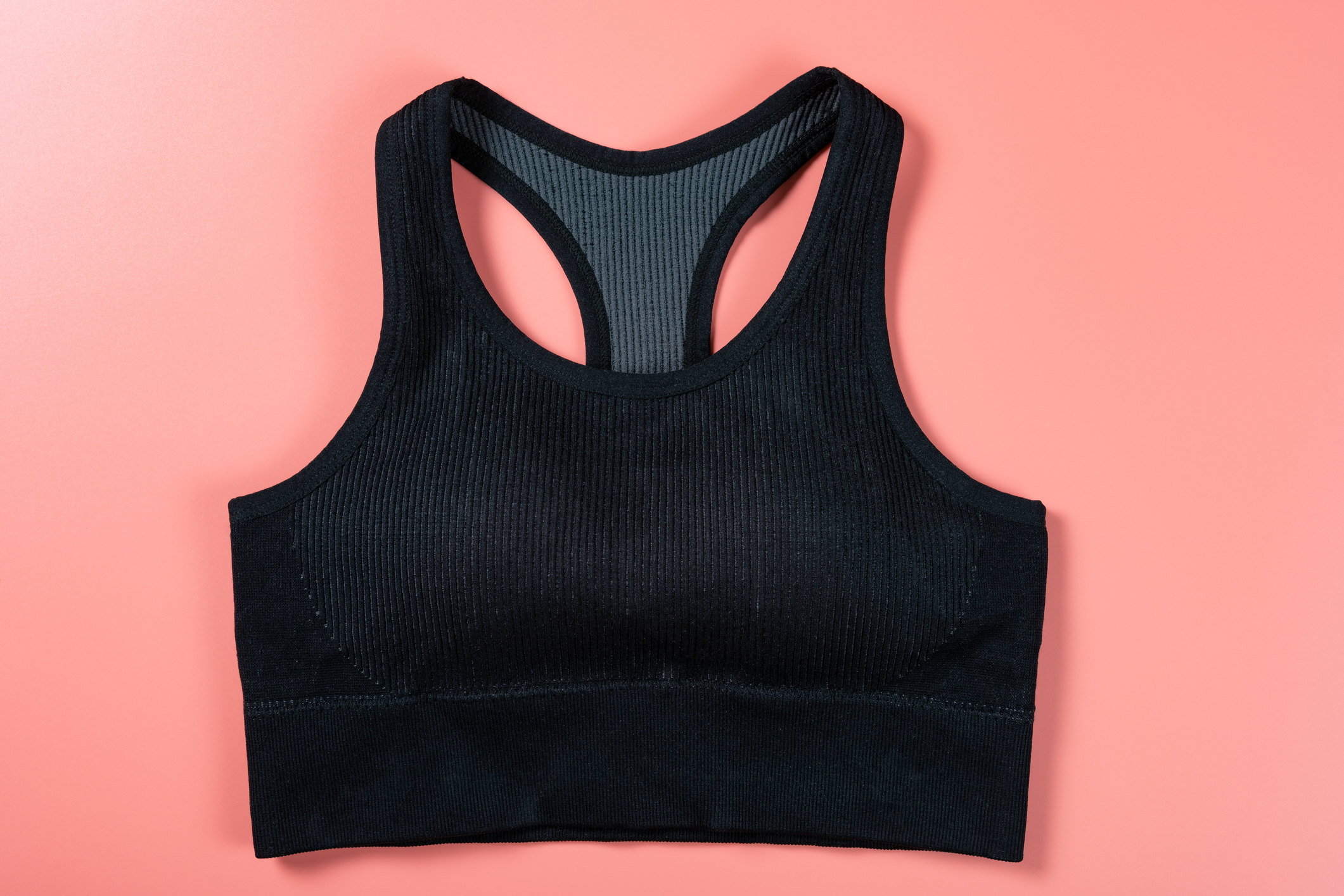 A black ribbed sports bra against a plain background