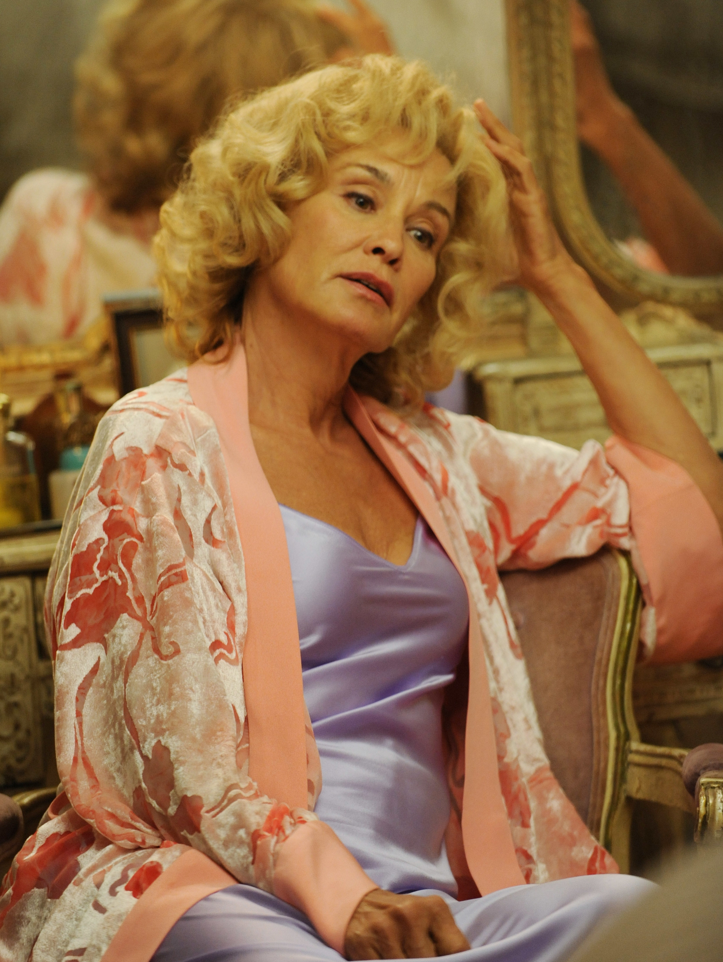 Jessica Lange in silk pajamas and a floral robe in "American Horror Story: Murder House"