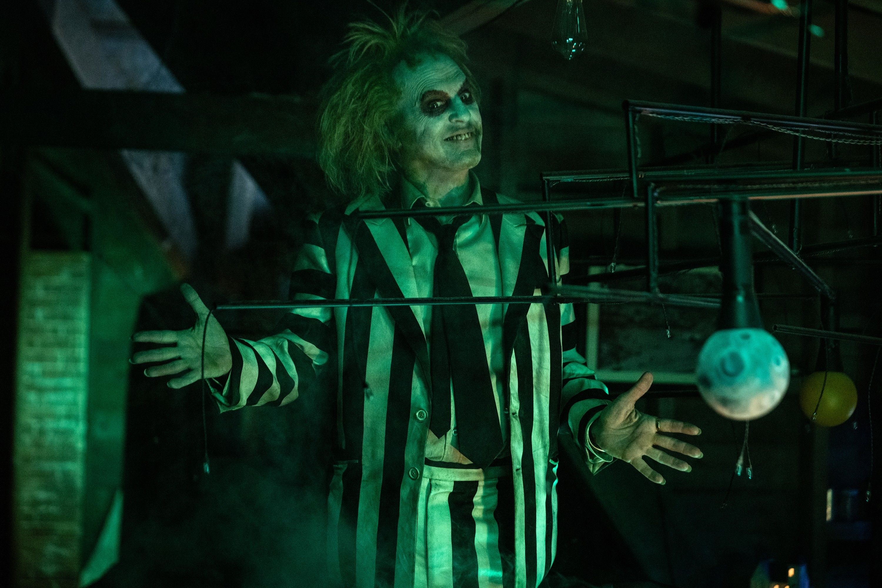 Michael Keaton in a striped suit in "Beetlejuice Beetlejuice"