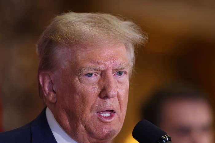 Donald Trump speaking at a podium