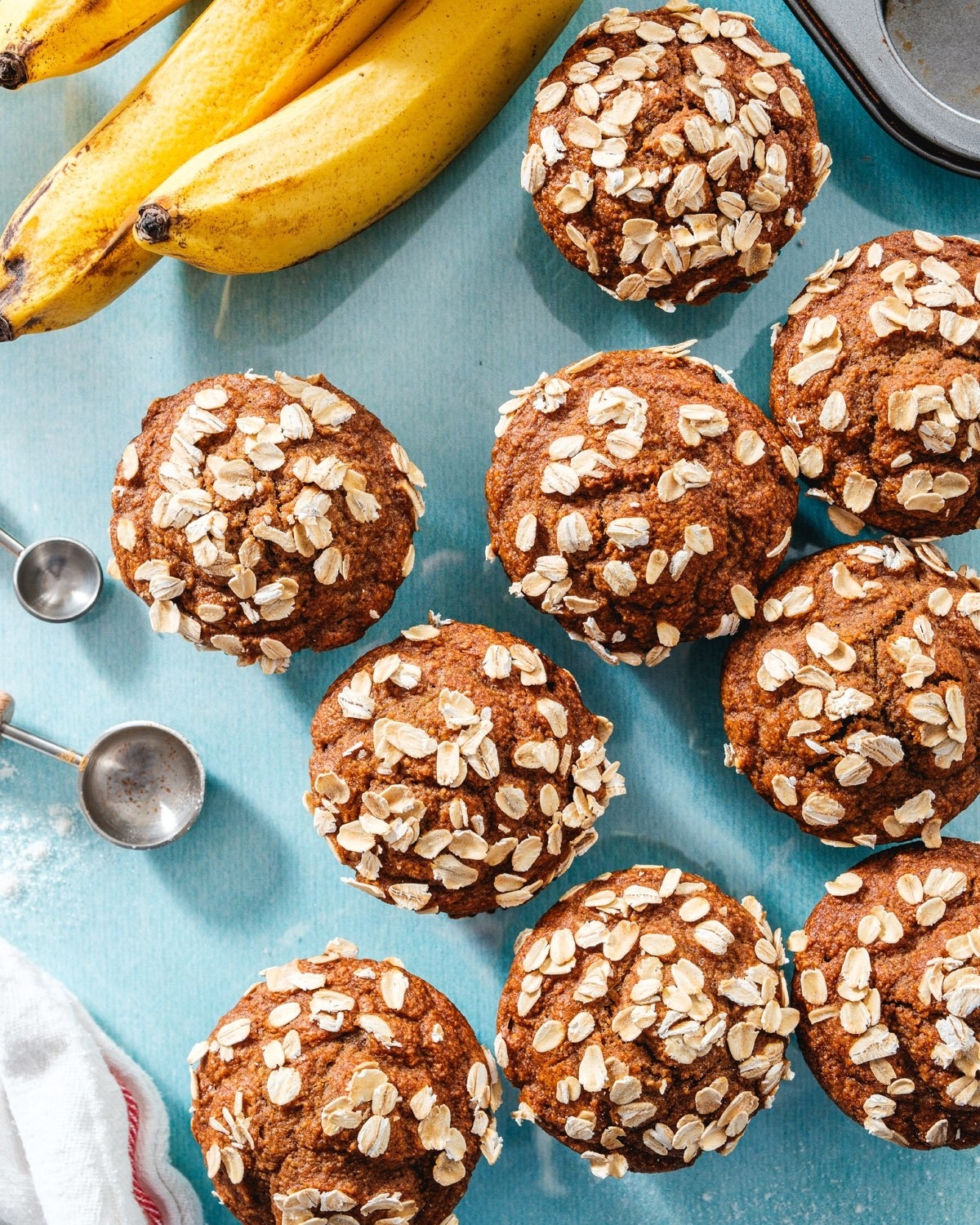 Eight oat-topped banana muffins