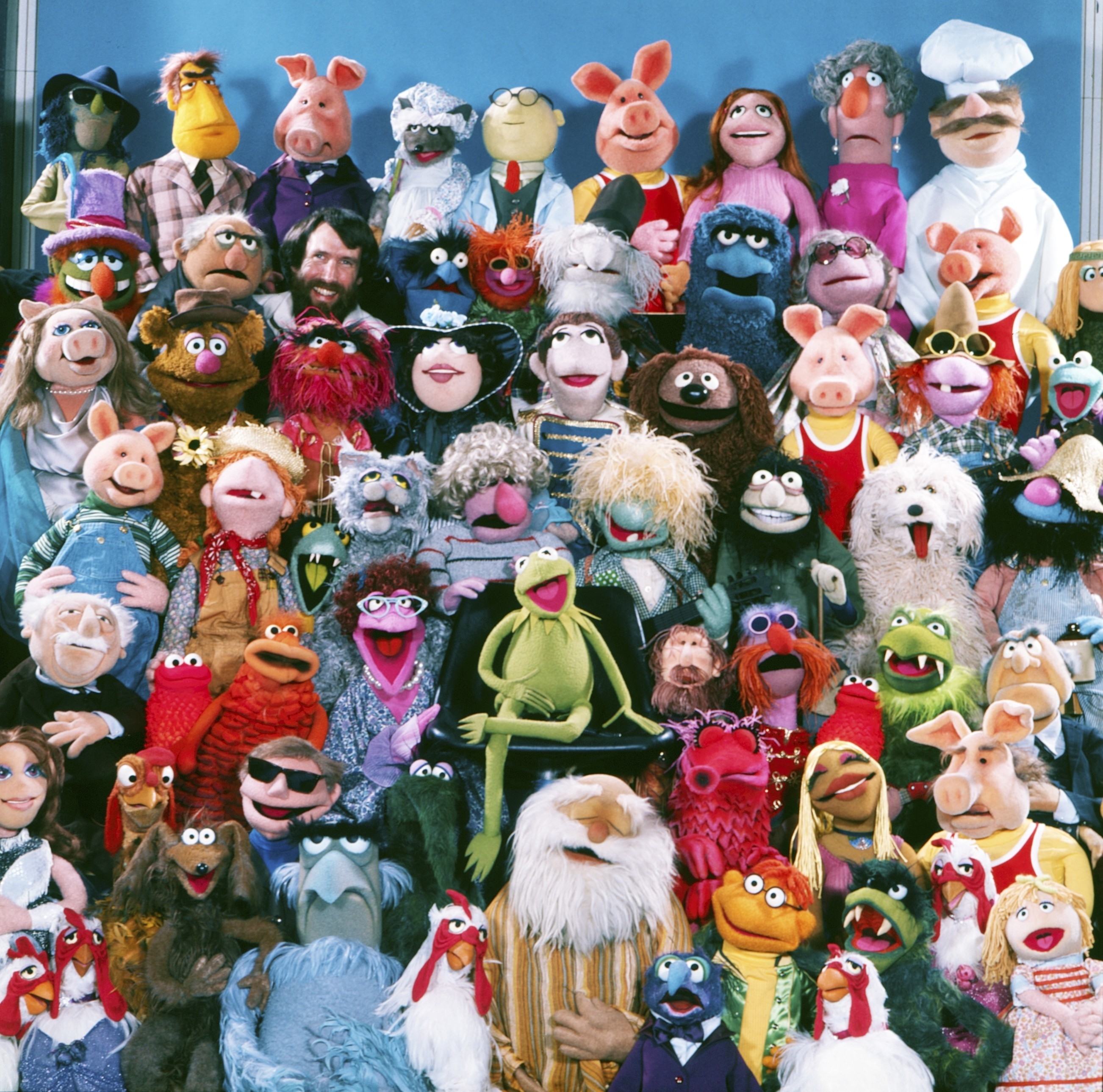 The Muppets group photo featuring Kermit, Miss Piggy, Fozzie Bear, Gonzo, Animal, and other Muppet characters posing together