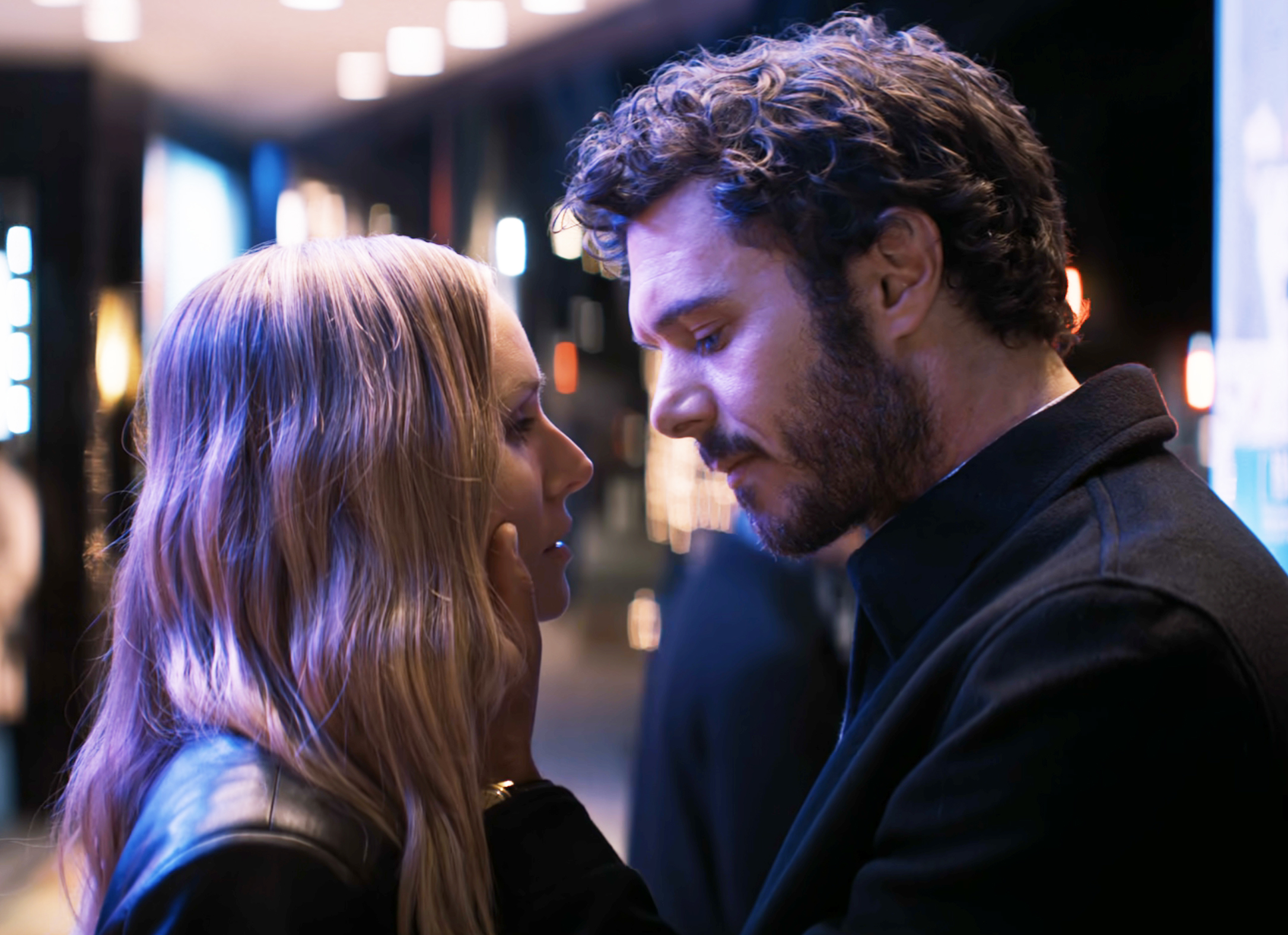 Adam Brody and Kristen Bell share an intimate moment, gazing into each other's eyes
