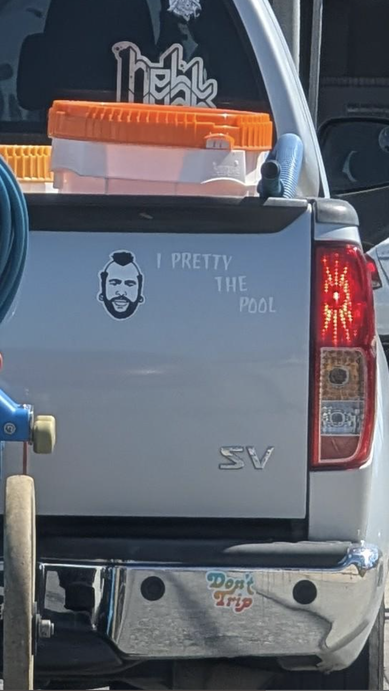 Pickup truck with pool supplies and a decal on the tailgate with a man’s face and the text, “I PRETTY THE POOL.”