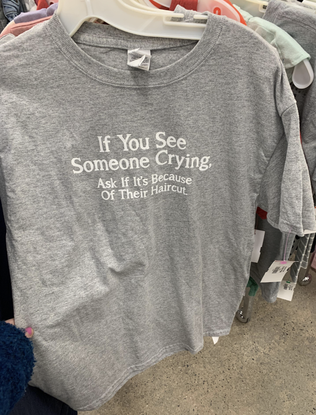 Gray T-shirt with text: &quot;If You See Someone Crying, Ask If It’s Because Of Their Haircut.&quot;