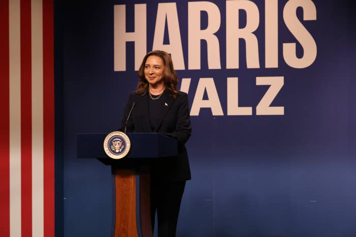 A woman at a podium with presidential seal, 