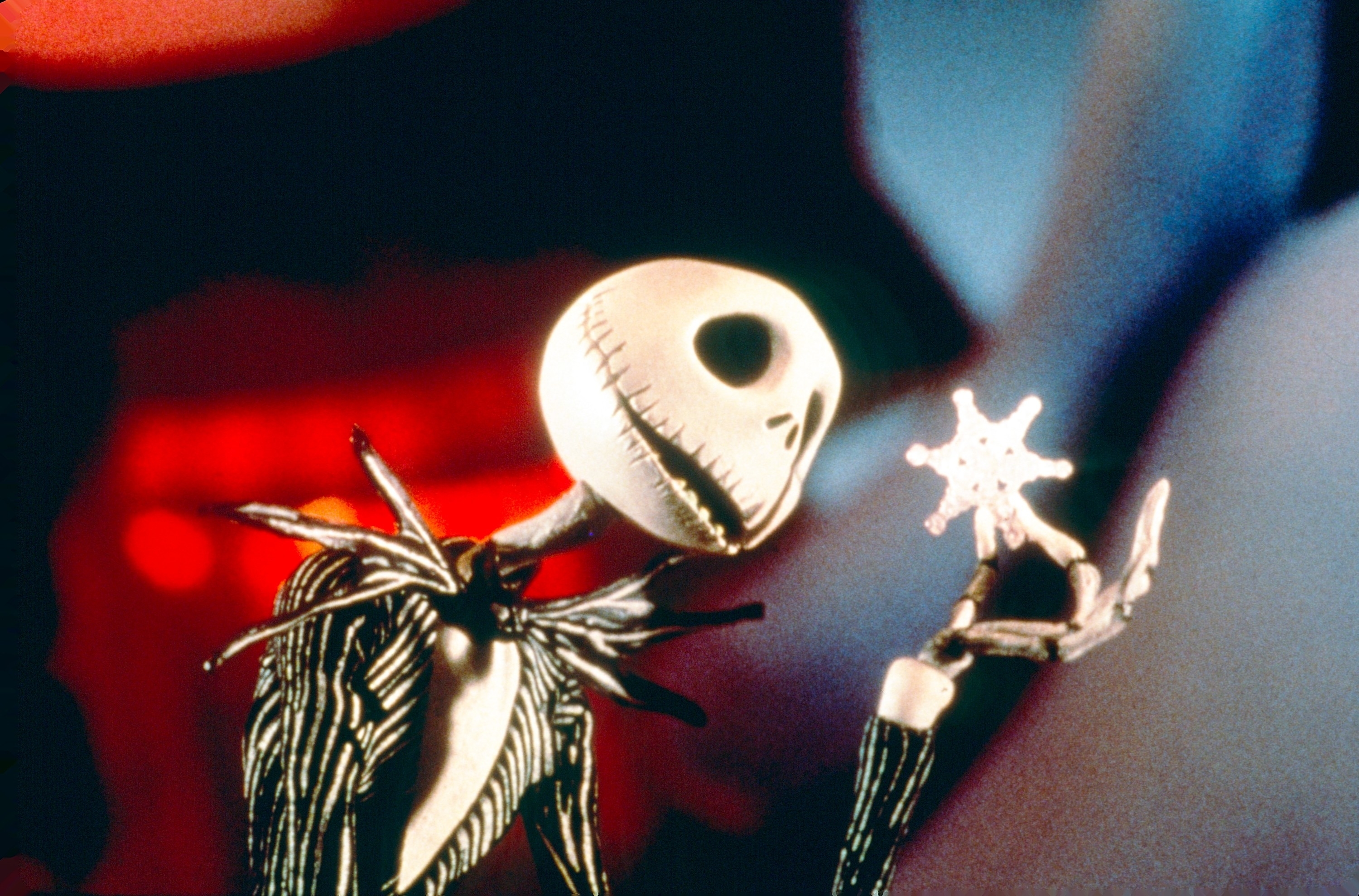 Jack Skellington, a skeleton in a striped suit, holds a snowflake in his bony fingers, from &quot;The Nightmare Before Christmas.&quot;