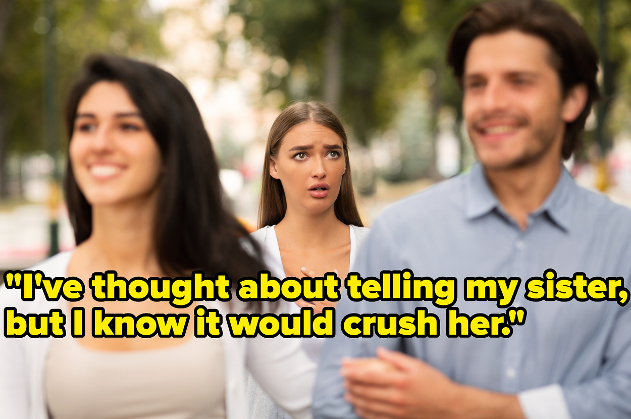 A worried woman stands behind a smiling couple walking arm-in-arm outdoors