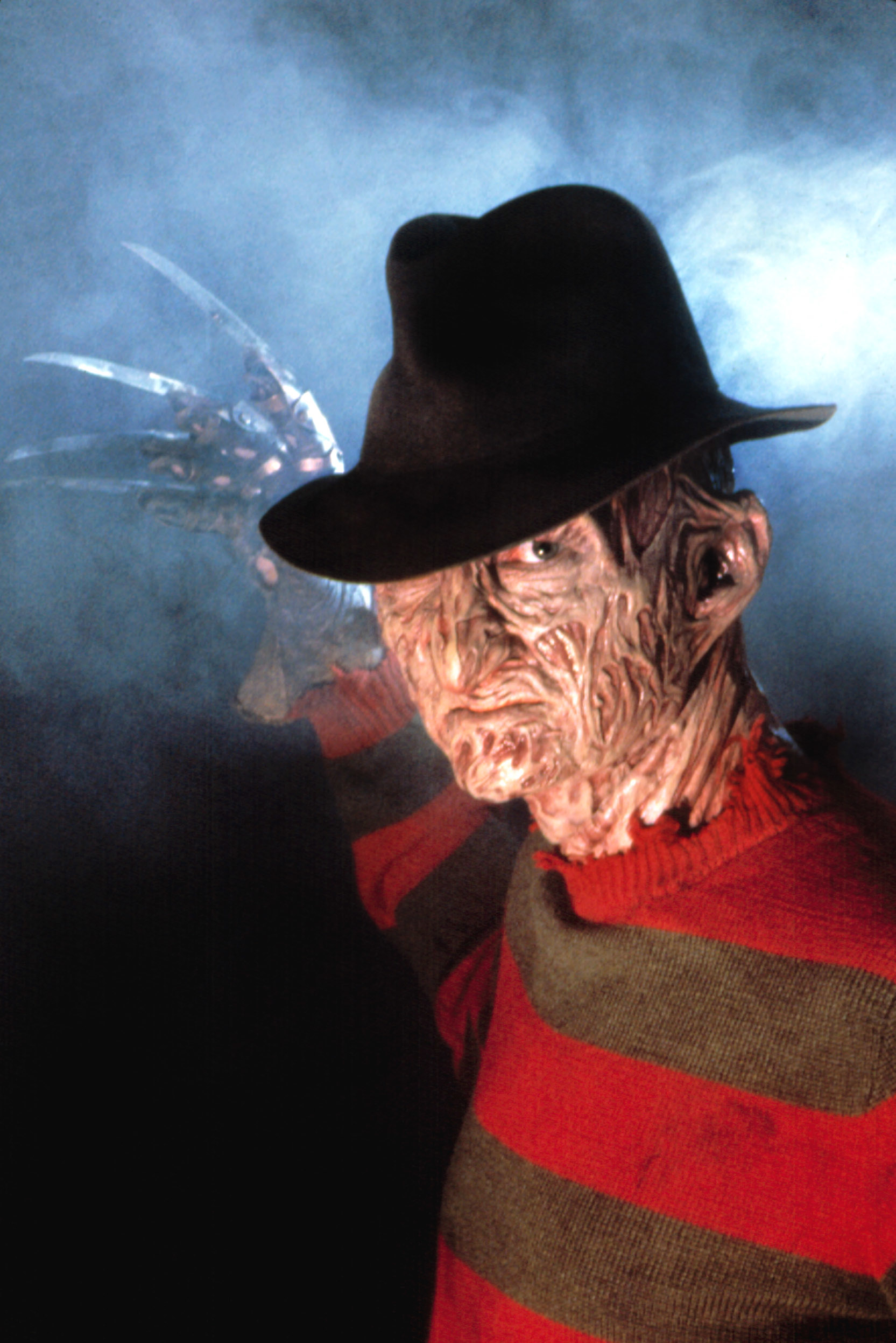 Freddy Krueger from &quot;A Nightmare on Elm Street&quot; wearing a fedora, red and green striped sweater, and glove with metal blades