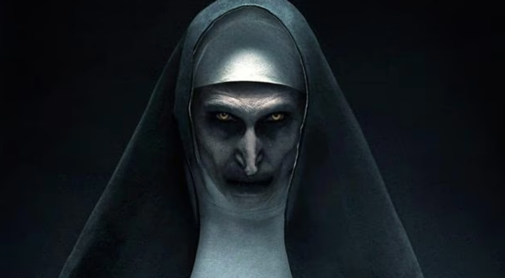 Horror character dressed as a nun with a sinister expression, from a movie scene