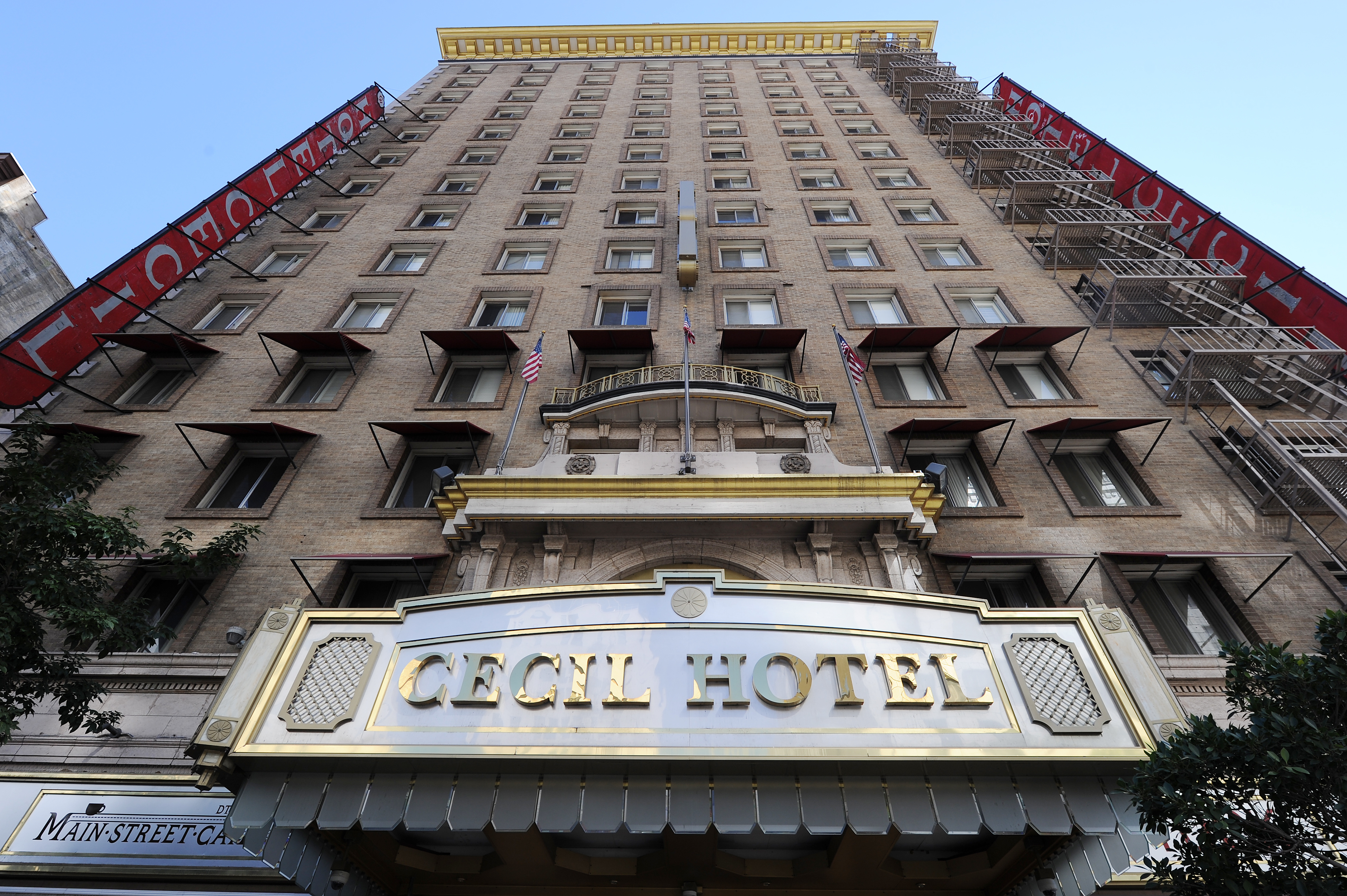 Cecil Hotel exterior view, a historic multi-story building with decorative architectural details and a prominent sign at the bottom