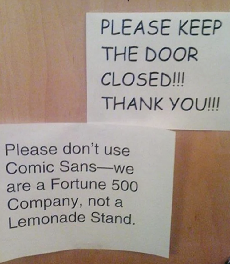 Signs read: &quot;Please keep the door closed!!! Thank you!!!&quot; and &quot;Please don’t use Comic Sans—we are a Fortune 500 Company, not a Lemonade Stand.&quot;