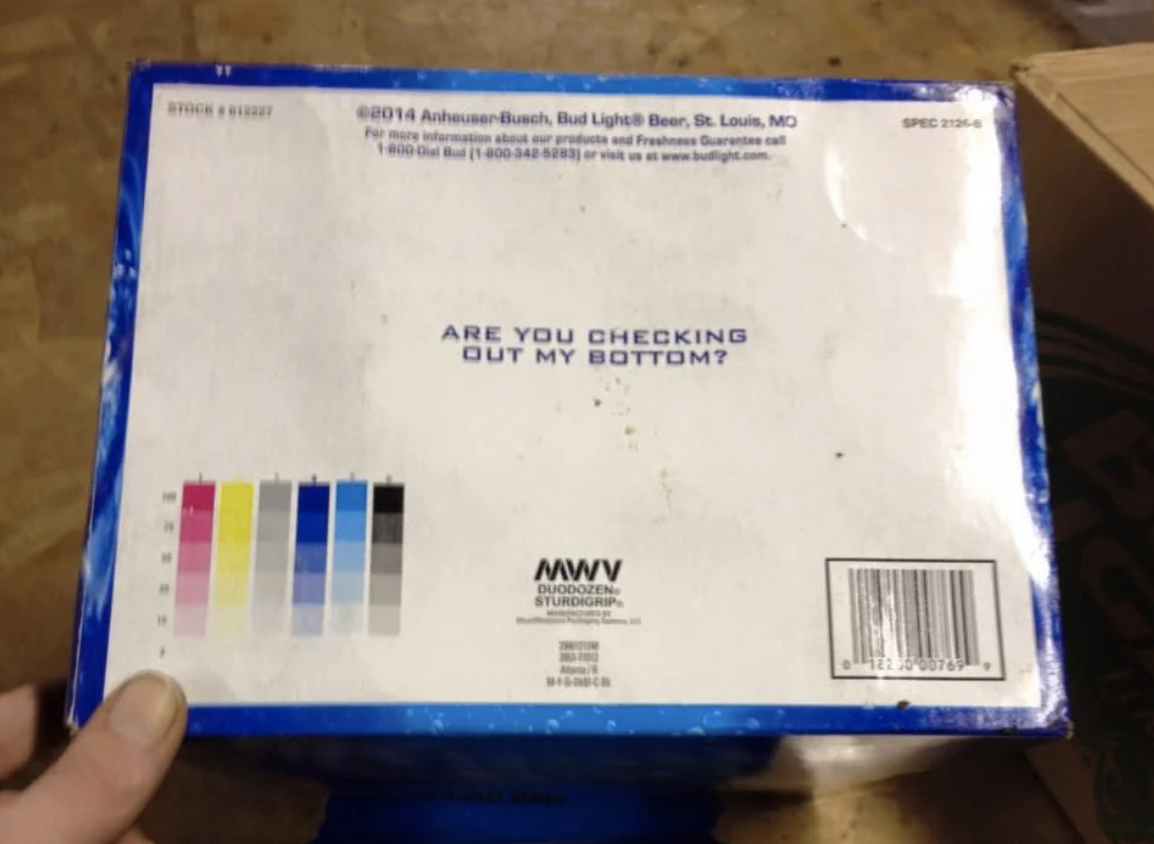 Box with text: &quot;Are you checking out my bottom?&quot; Includes a color testing strip and Anheuser-Busch contact details