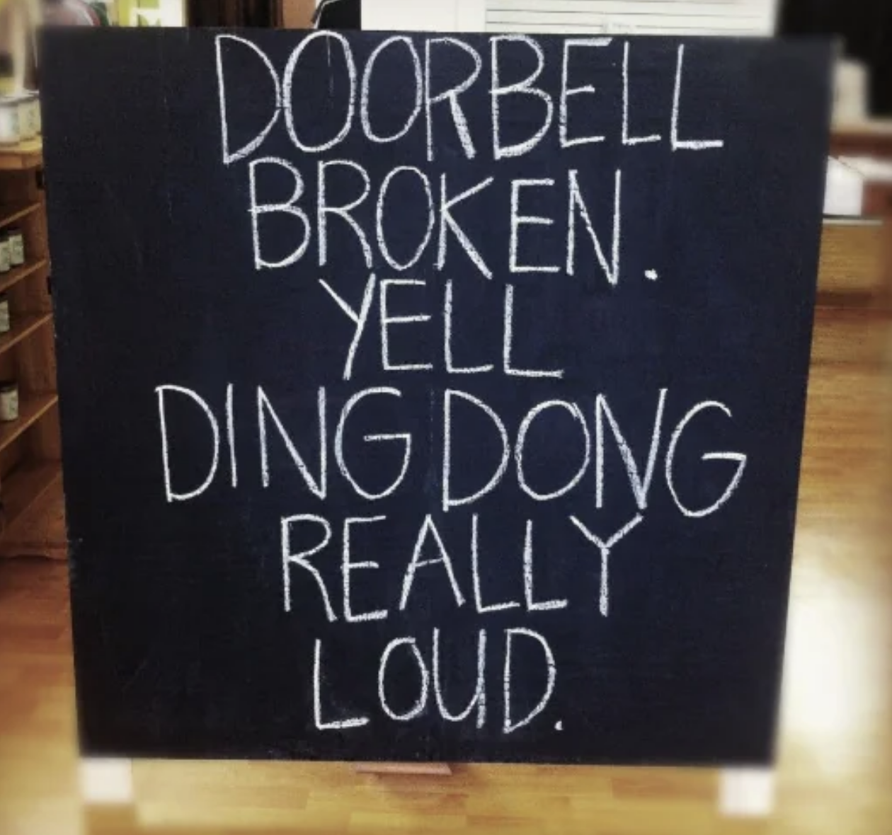 Sign reads: &quot;Doorbell broken. Yell ding dong really loud.&quot;