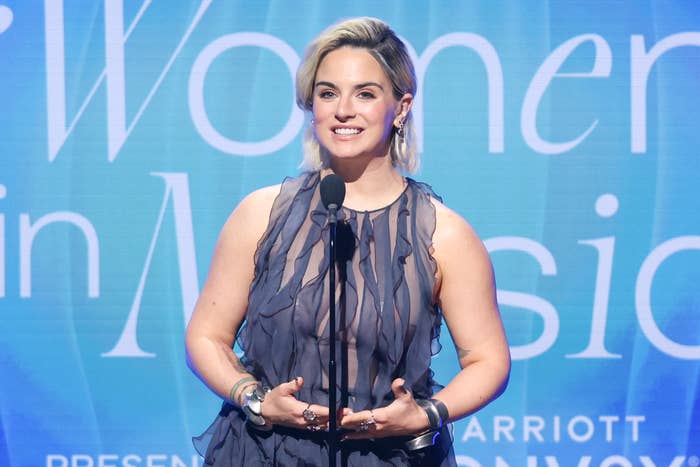 JoJo gives a speech in a ruffly dress